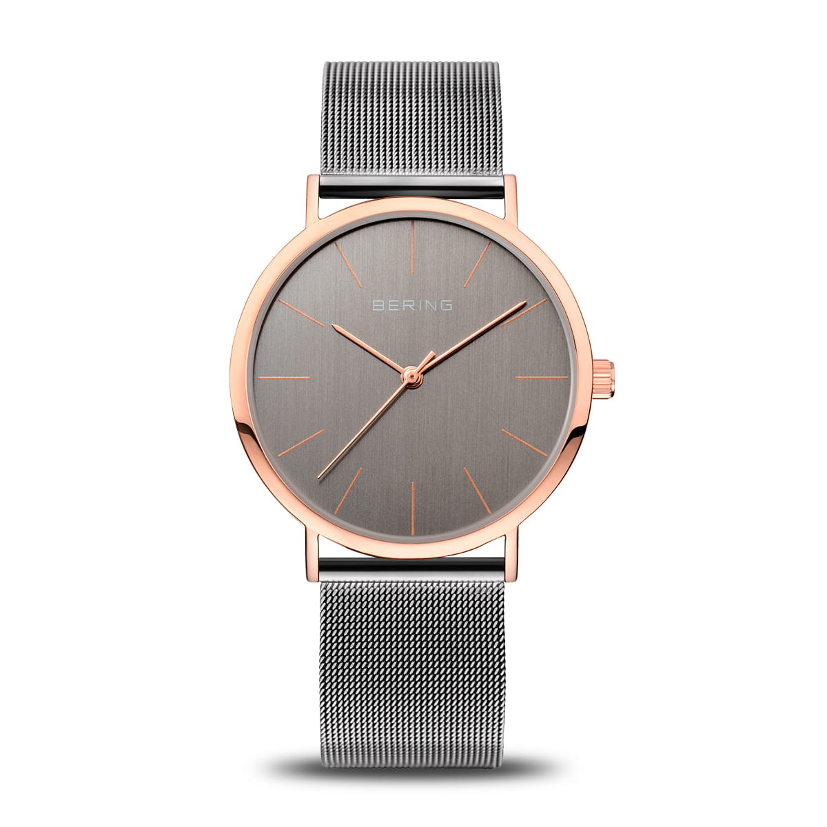 Orologio con cassa rotonda in acciaio rosa, quadrante grigio e cinturino in maglia metallica.