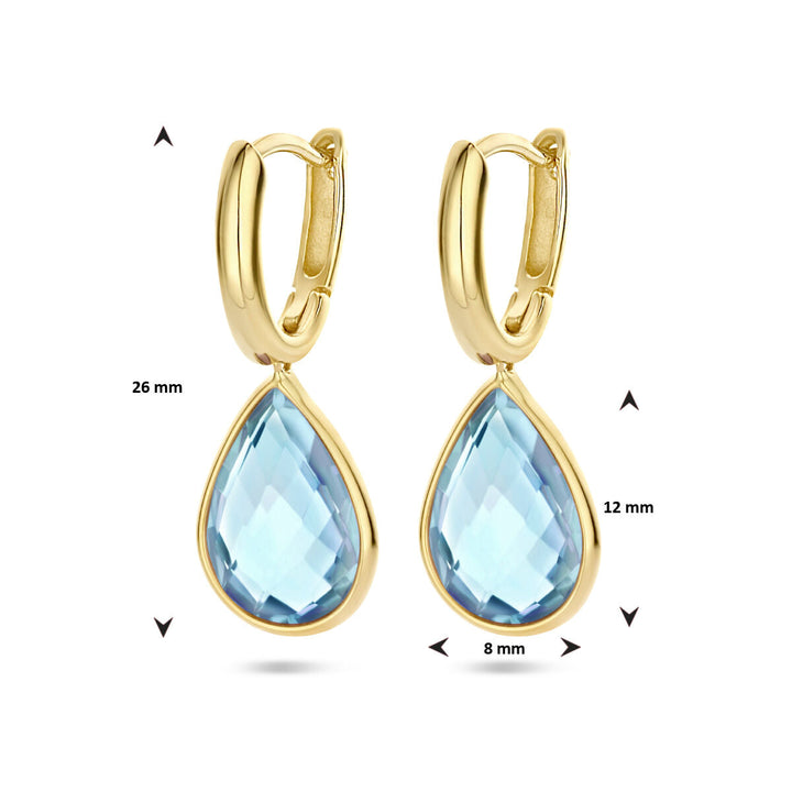 Van der Kooij Collectie klapoorringen blauw topaas 14K geelgoud, elk met een druppelvormige blauwe topaas van 12x8 mm. Totale lengte: 26 mm. Pijlen en maten getoond ter illustratie.