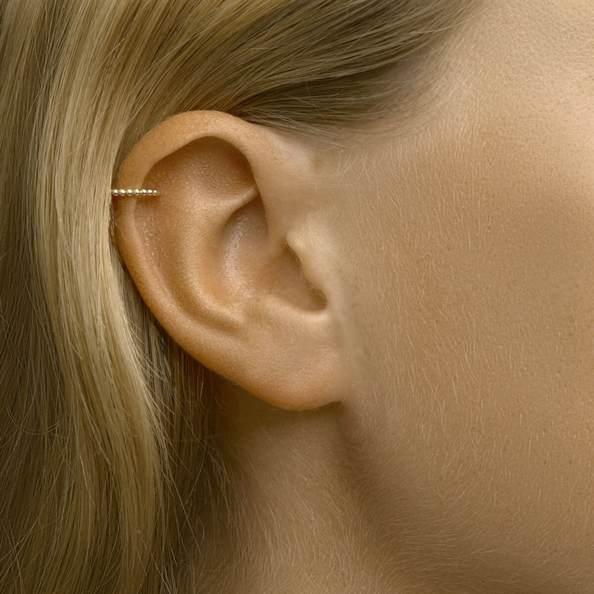 earcuff con sferette al pezzo oro giallo 14K