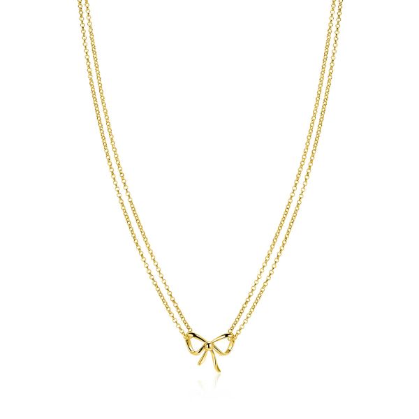 Collana dorata a doppio filo con un pendente a forma di fiocco.