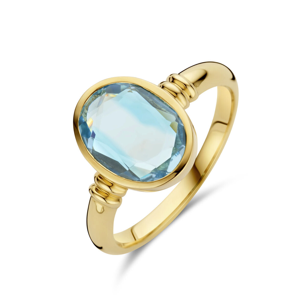 Anello in oro giallo 14K con topazio azzurro ovale.
