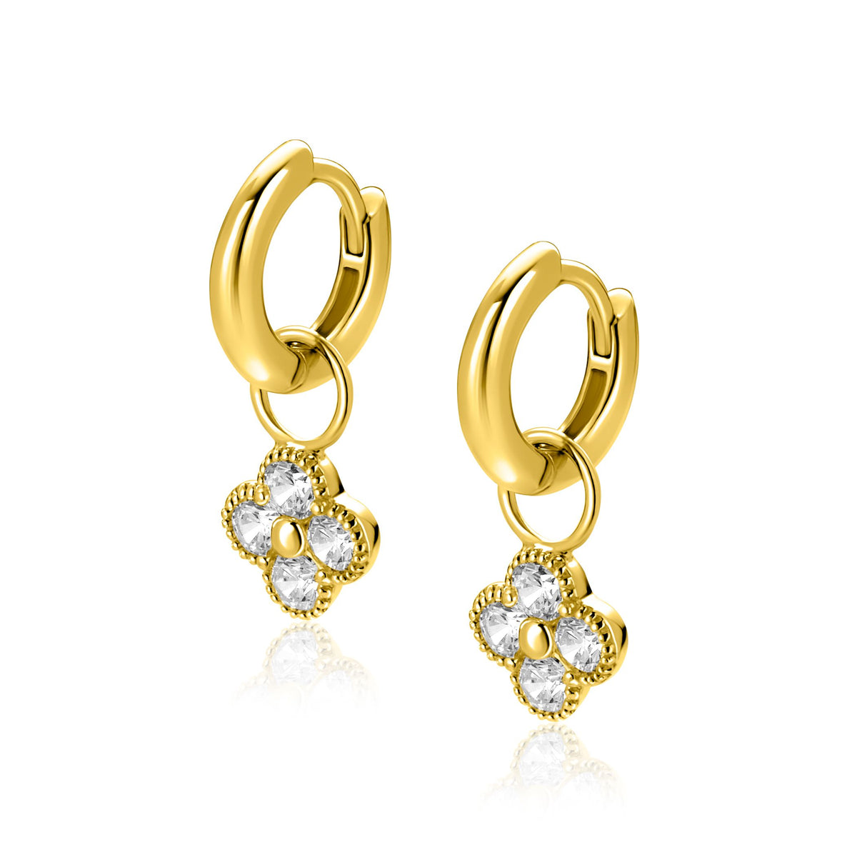 Orecchini alla creola in oro con pendenti a forma di fiore decorati con pietre brillanti.