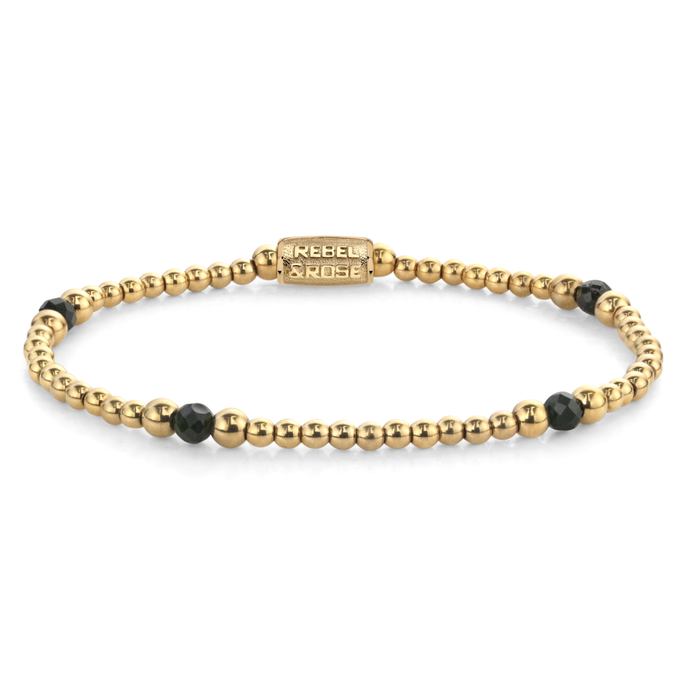 Bracciale da donna con perline dorate e dettagli in pietra nera, design semplice.