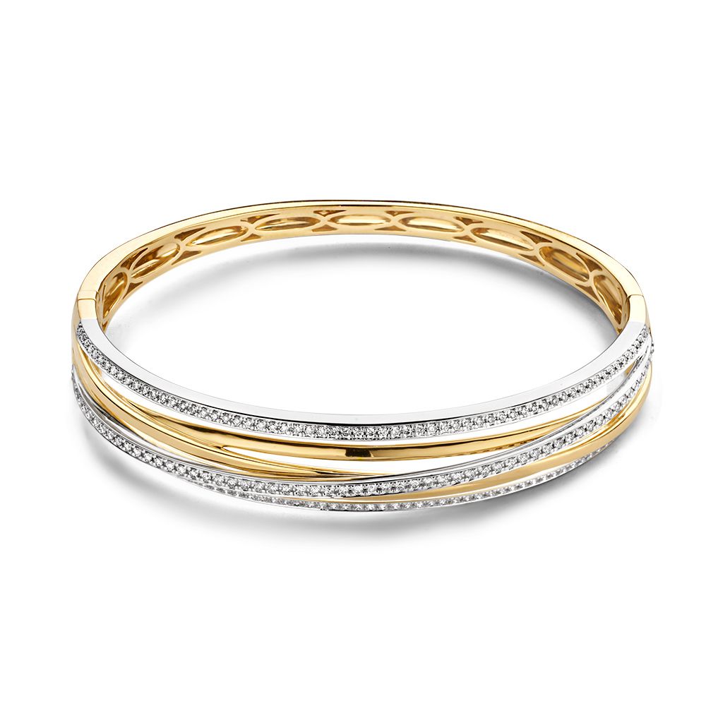 Bracciale in oro giallo e bianco con brillanti, treccia elegante e dettagli incisi.