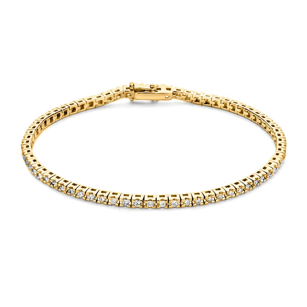 Bracciale in oro giallo con pietre brillanti, design sottile e lucido.