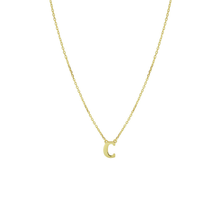 De Gouden dames ketting letter 14K van Van der Kooij Collectie is een delicaat 14k geelgouden collier met een kleine, gouden letter C hanger-ideaal als gepersonaliseerd sieradencadeau voor dames.