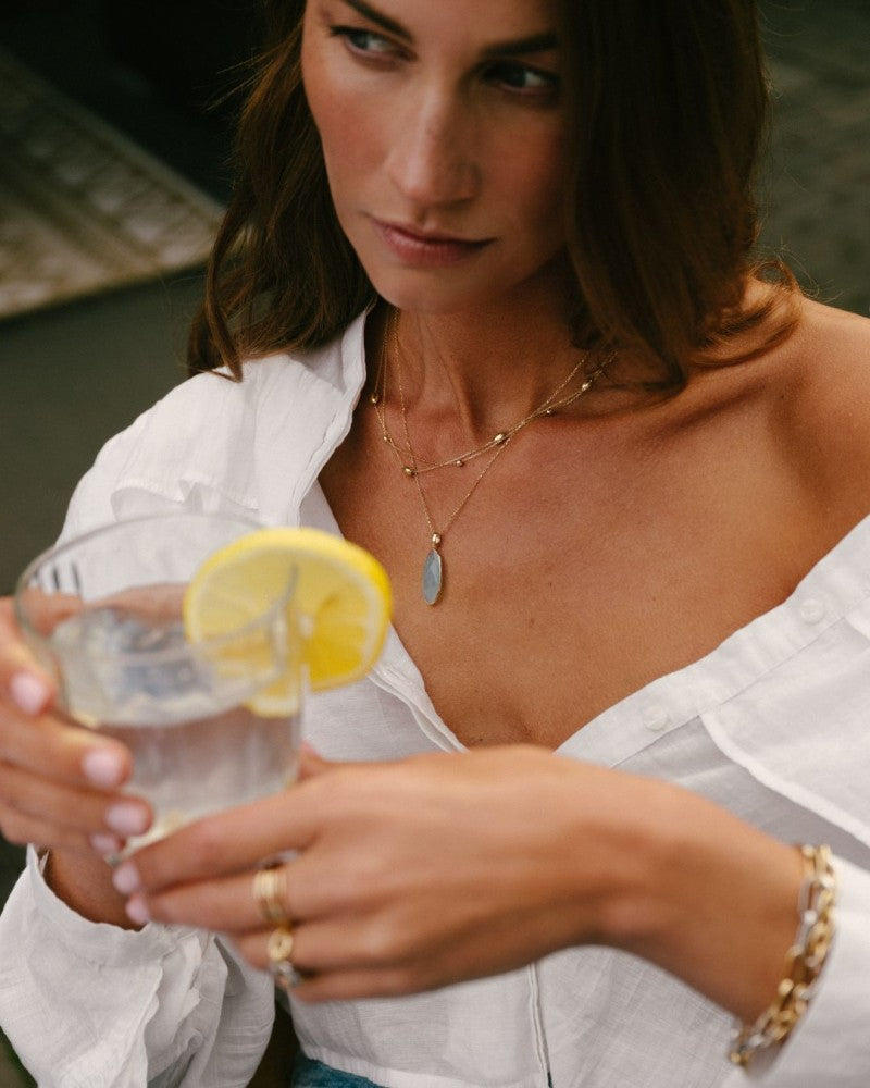 Collana in Oro Giallo con Maglia Ancora e Ciondolo Ovale in Acquamarina – Oro 14 Carati
