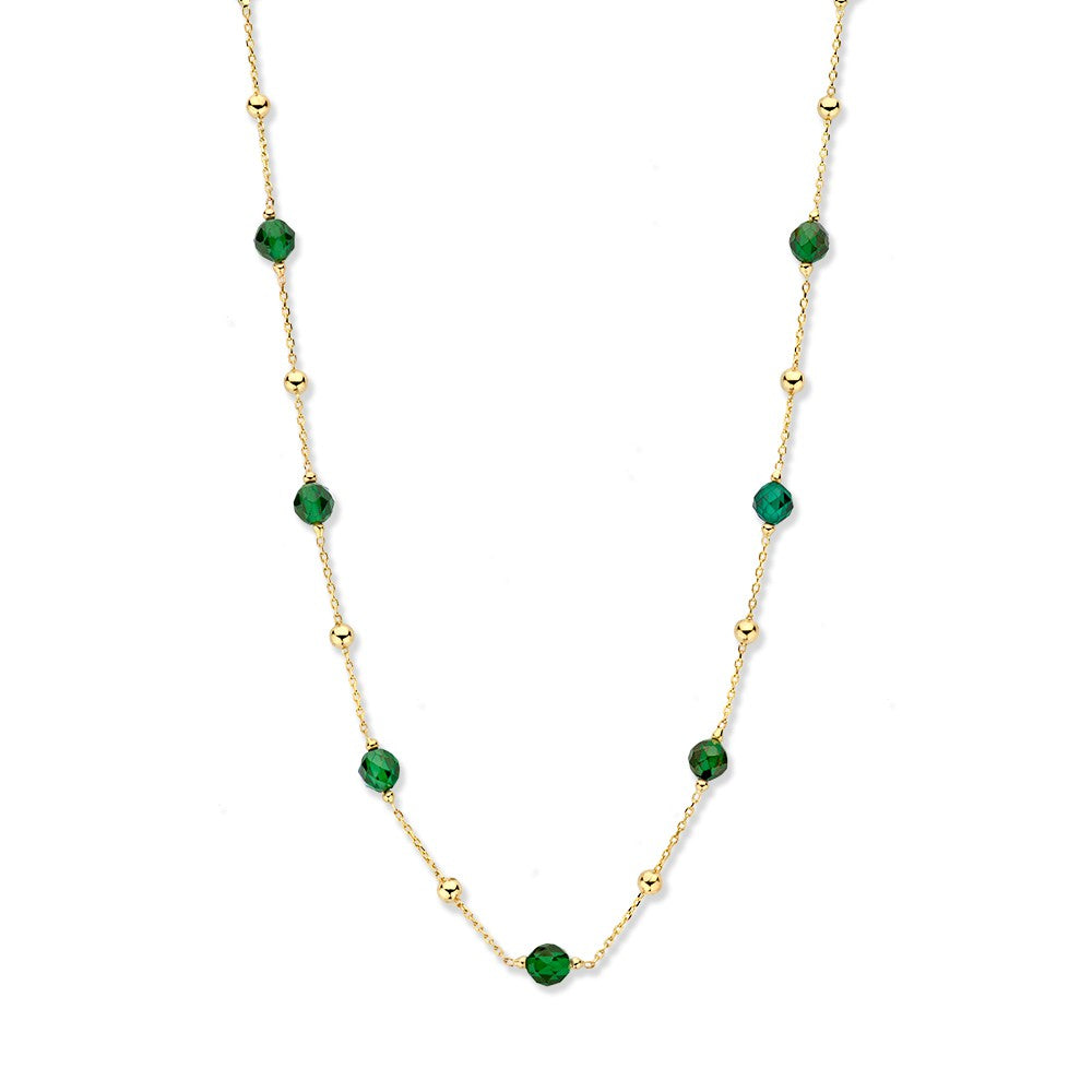Collana in oro giallo con pallini dorati e zirconi verdi.