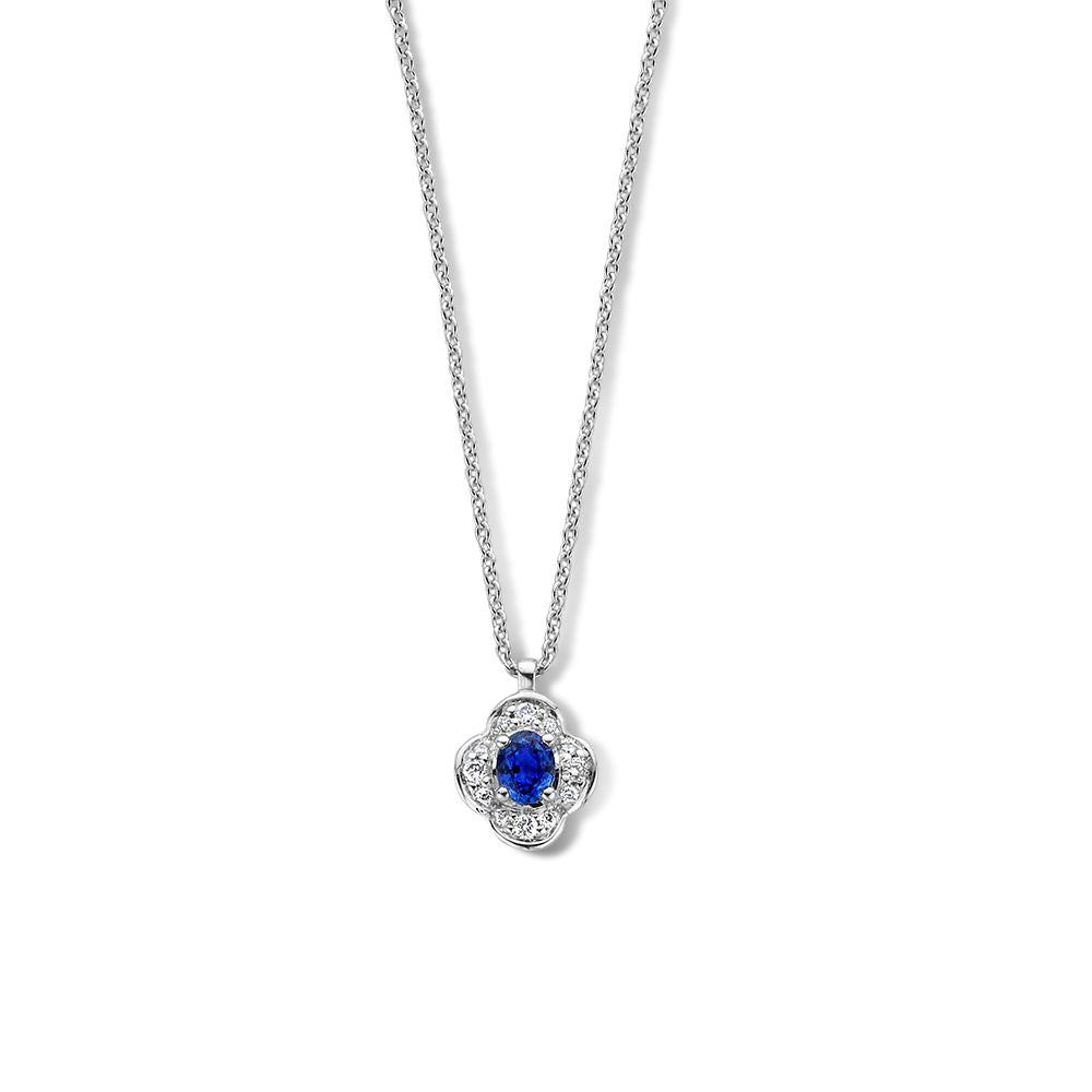 Collana in oro bianco con pendente a forma di fiore, zaffiro blu e diamanti.