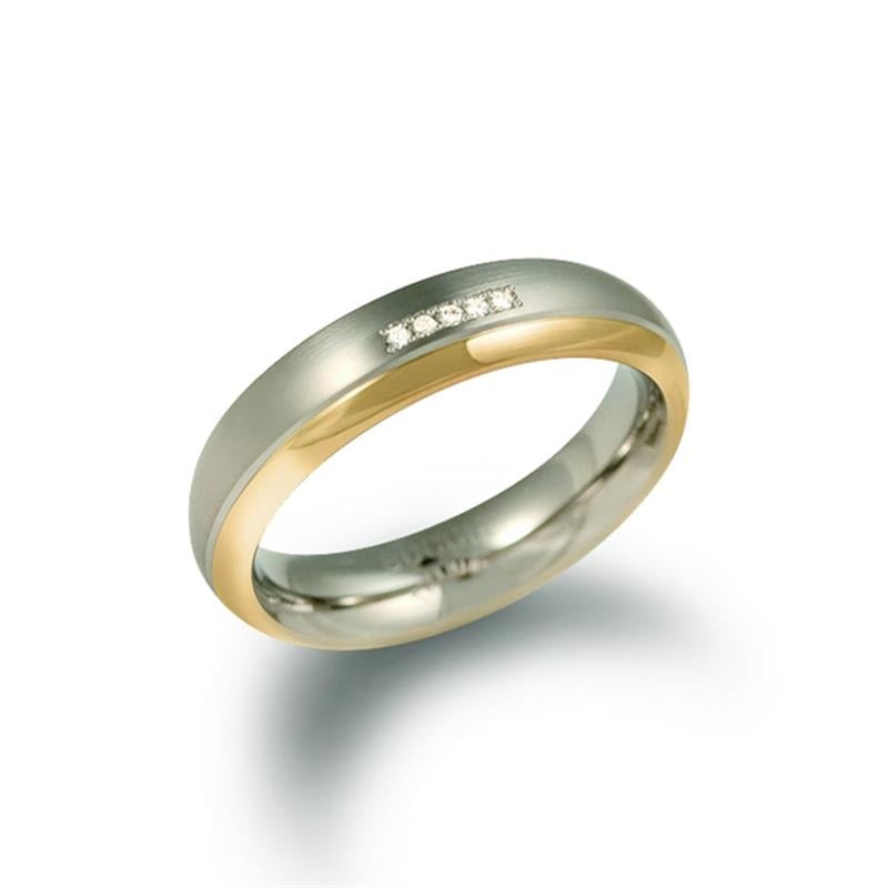 Anello in titanio bicolore con finitura lucida e dettagli in oro.