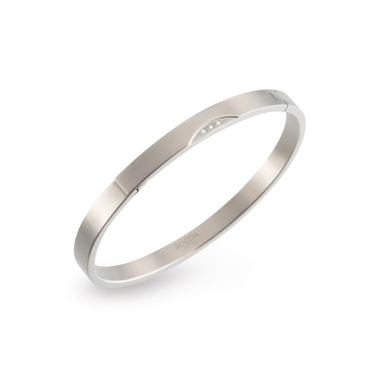 Bracciale in titanio con finitura lucida, forma rigida e design minimalista.