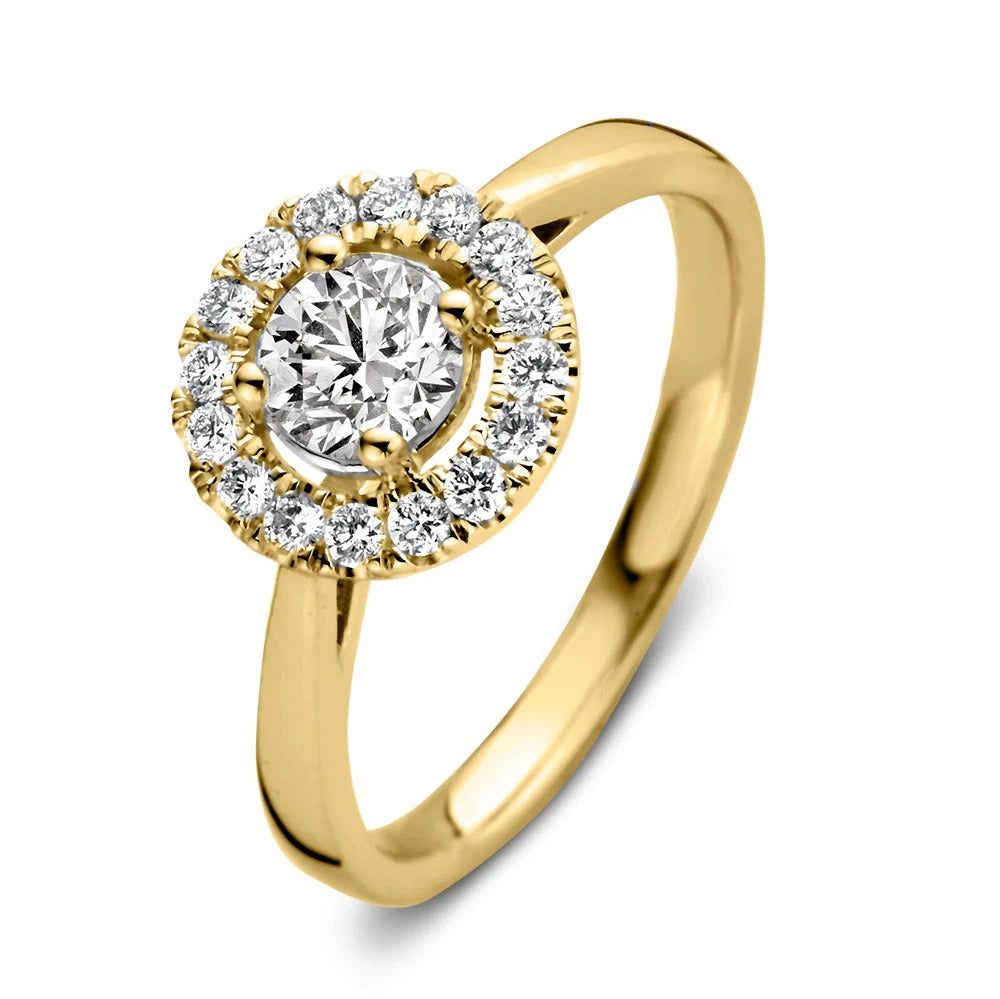 Anello in oro giallo con diamante centrale e zirconi incastonati a forma rotonda.