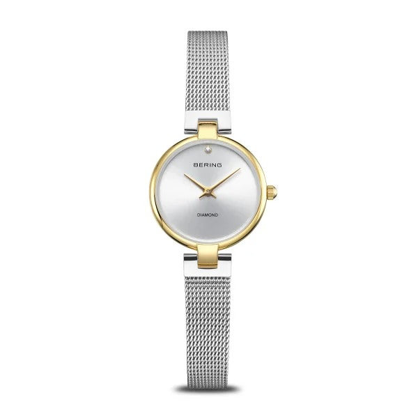 Orologio da donna Bering, quadrante argentato con cassa dorata e cinturino in maglia rolò argentata.