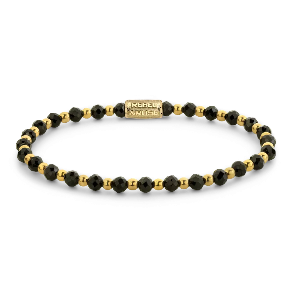 Bracciale con pietre nere e dettagli in oro giallo.