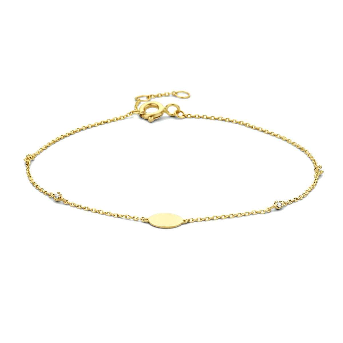 Bracciale in oro giallo 9k con zirconi, design delicato con maglia fine e elemento ovale centrale.