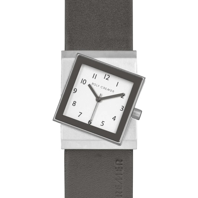 Orologio quadrato Rolf Cremer con cassa argentata, quadrante bianco e cinturino in pelle grigia.