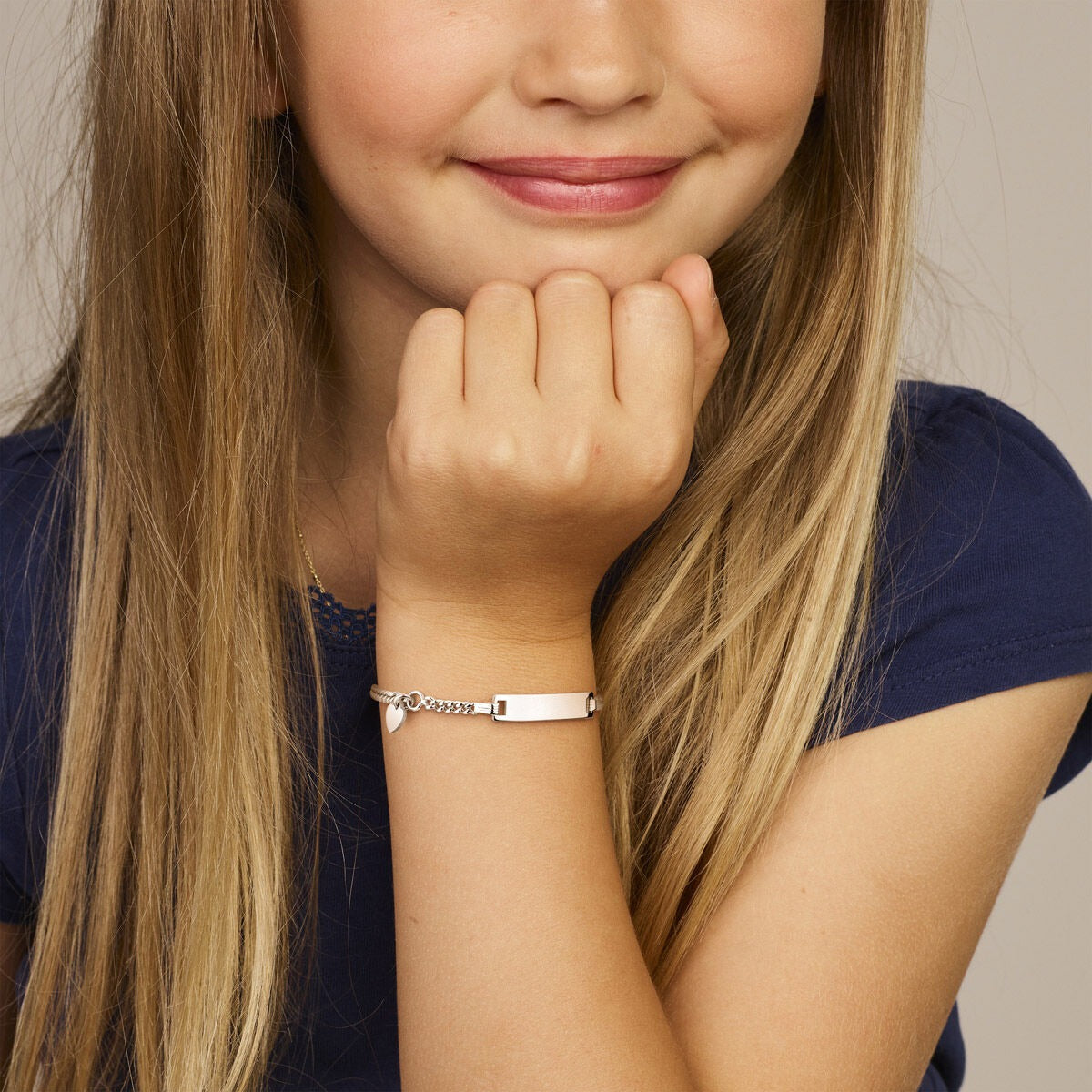 Gerhodineerde zilveren kinderarmband met plat hartje