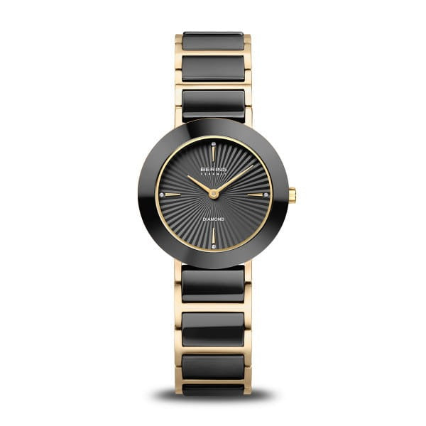 Orologio da donna con quadrante nero, cassa rotonda e bracciale in acciaio dorato e nero.