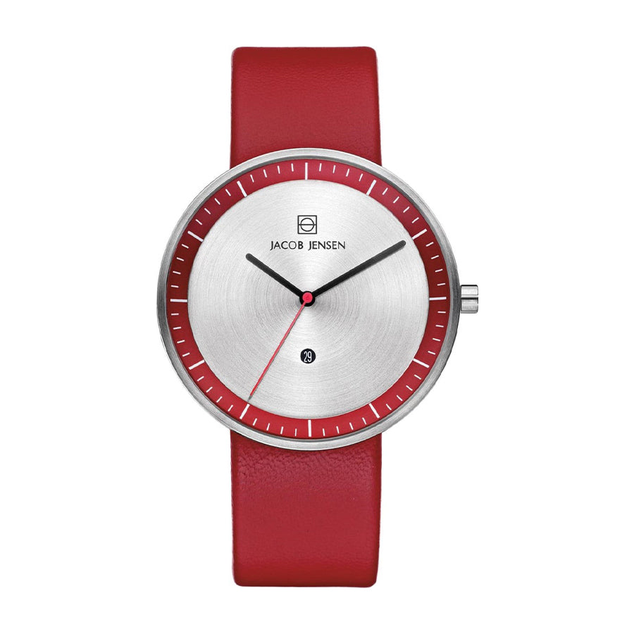 Orologio con quadrante argentato e cinturino rosso, dettagli minimalisti e indicatore della data.