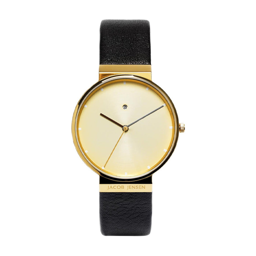 Orologio con cassa dorata, quadrante chiaro e cinturino in pelle nera.