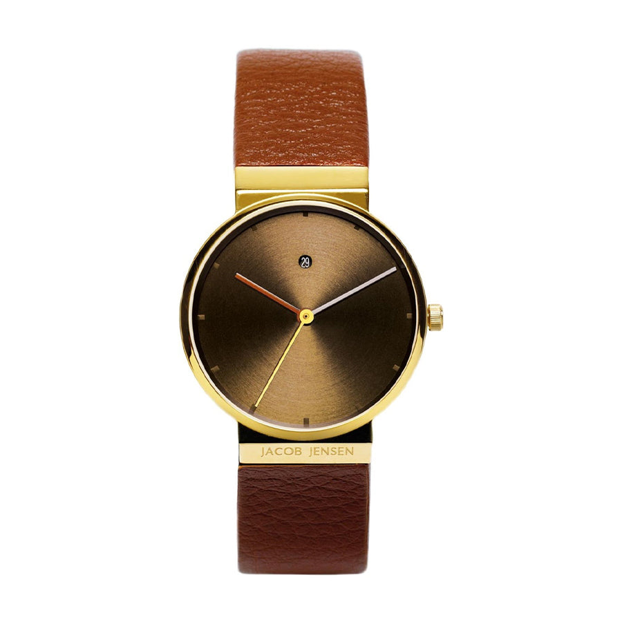 Orologio con cassa dorata, quadrante marrone sfumato e cinturino in pelle marrone.