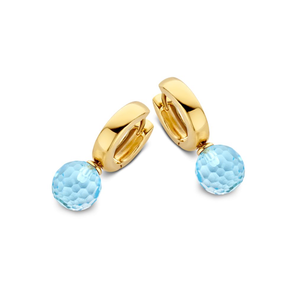 Orecchini in oro giallo con pendenti in topazio azzurro, design raffinato e lucido.