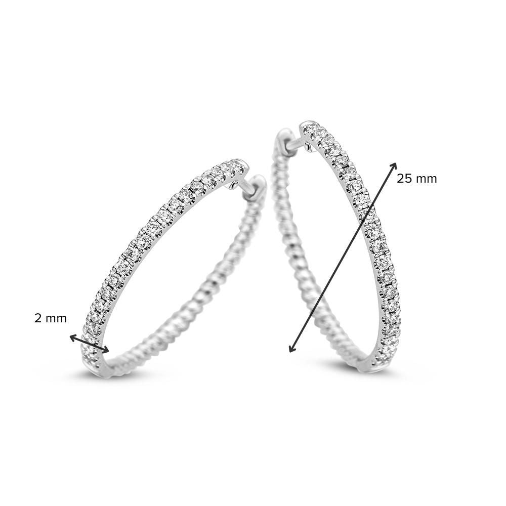 Orecchini a cerchio in oro bianco con diamante 0.48 crt – 14 carati 0,48 crt.