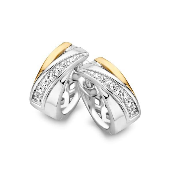 Orecchini eleganti in argento e oro con zircone, dalla forma ondulata e dettagli brillanti.