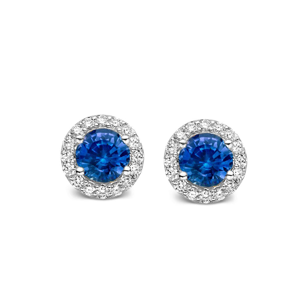 Orecchini in oro bianco 18kt con zaffiri blu circondati da diamanti.