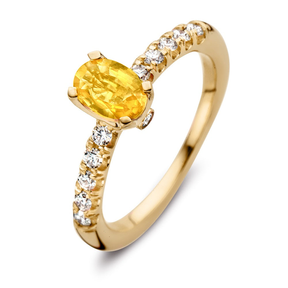 Anello in oro giallo 18kt con zaffiro giallo ovale e diamanti da 0,54 ct.