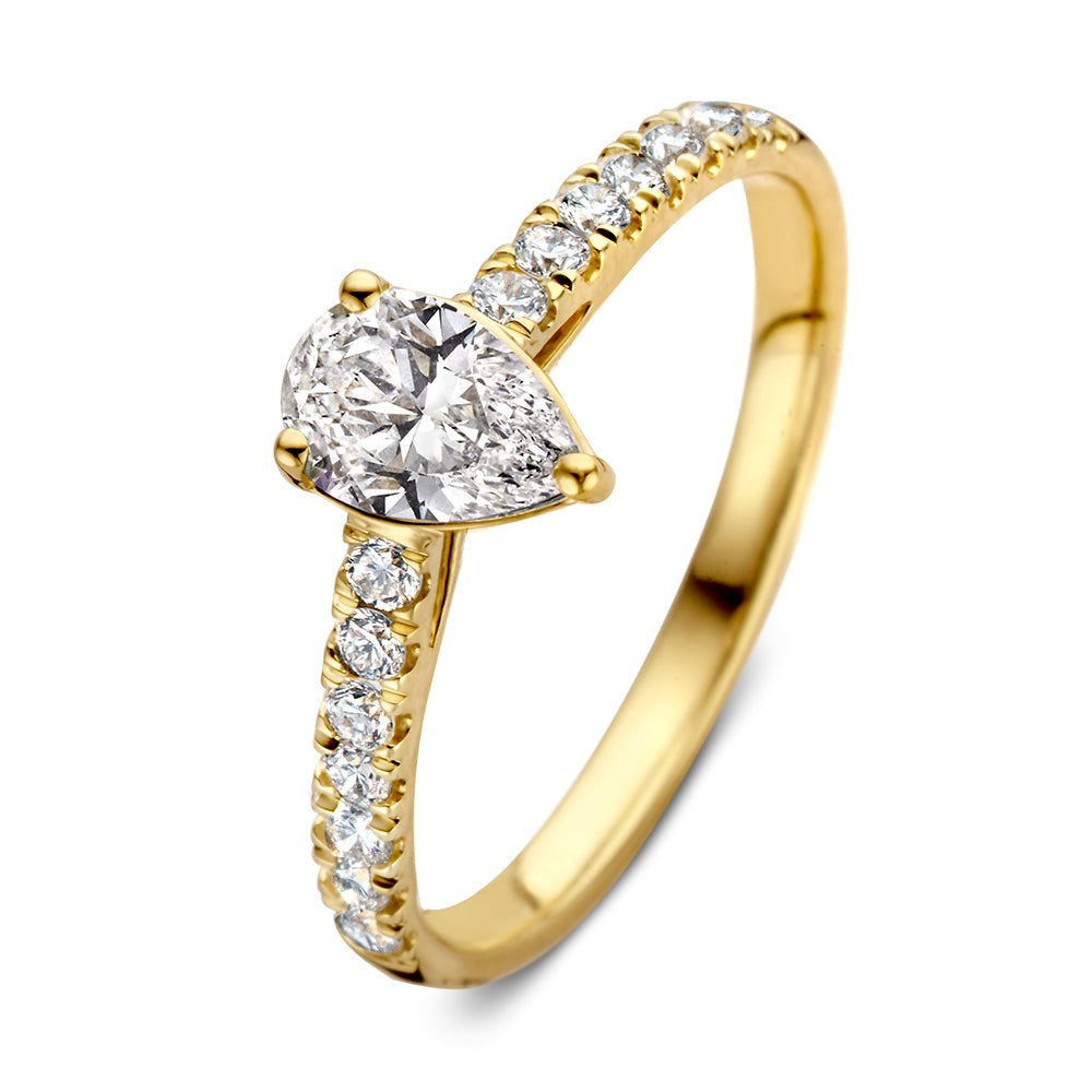 Anello in oro giallo con diamante a forma di pera e zirconi lungo la fascia.