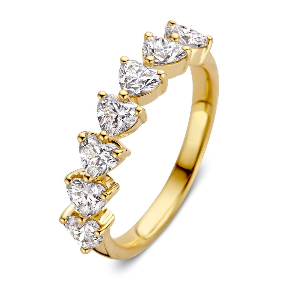Anello in oro giallo con sette pietre preziose a forma di cuore.