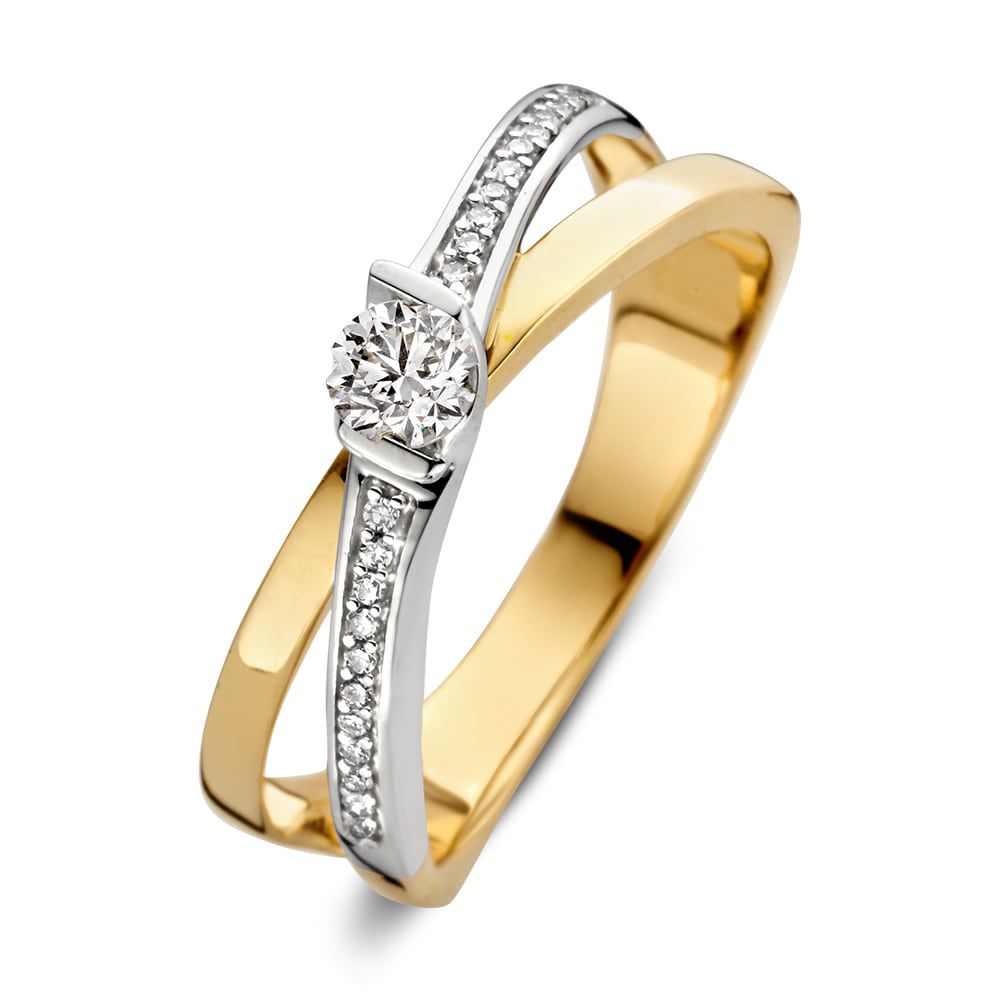 Anello bicolore in oro giallo e bianco con diamante brillante da 0,22 ct e 22 piccoli diamanti.