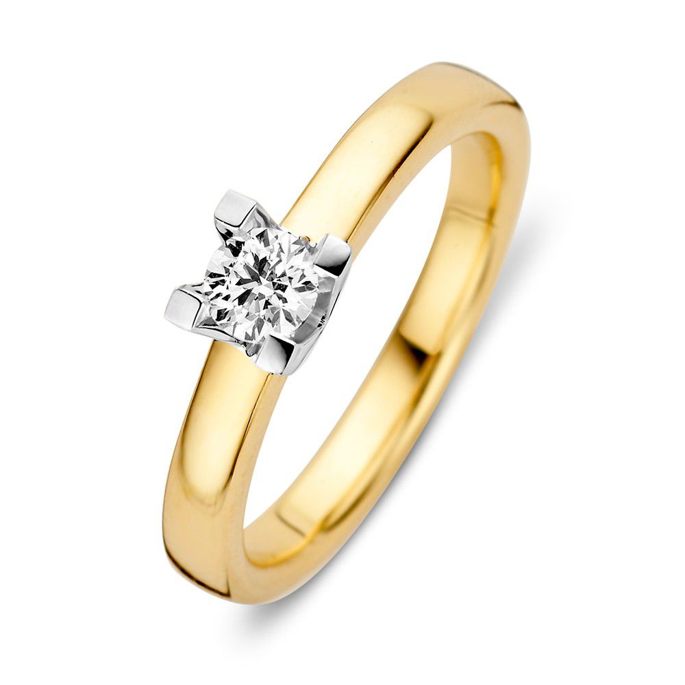 Anello in oro giallo e bianco con diamante brillante di 0,30 crt e montatura a quattro griffe.