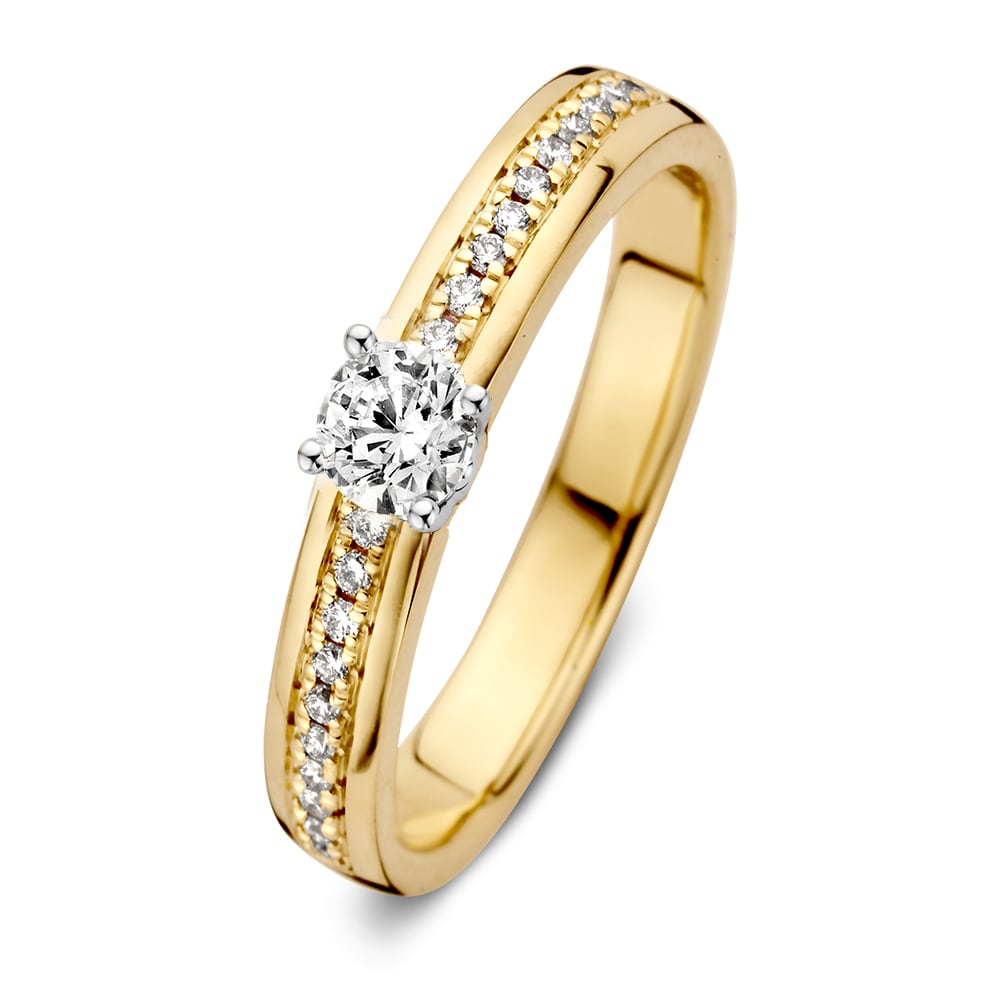 Anello elegante in oro giallo con montatura in oro bianco e brillante da 0,30 ct.