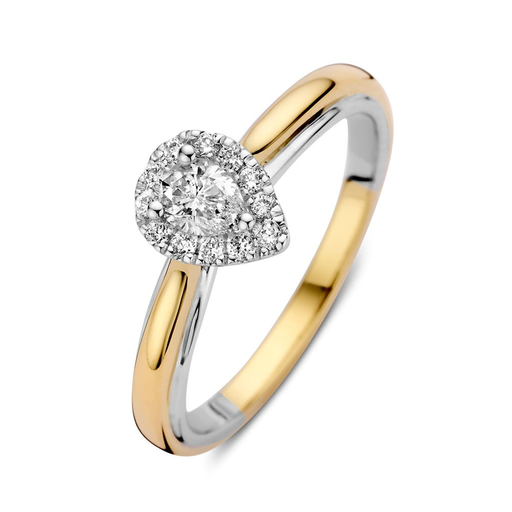Anello bicolore in oro 14k con diamante a forma di pera in montatura entourage.