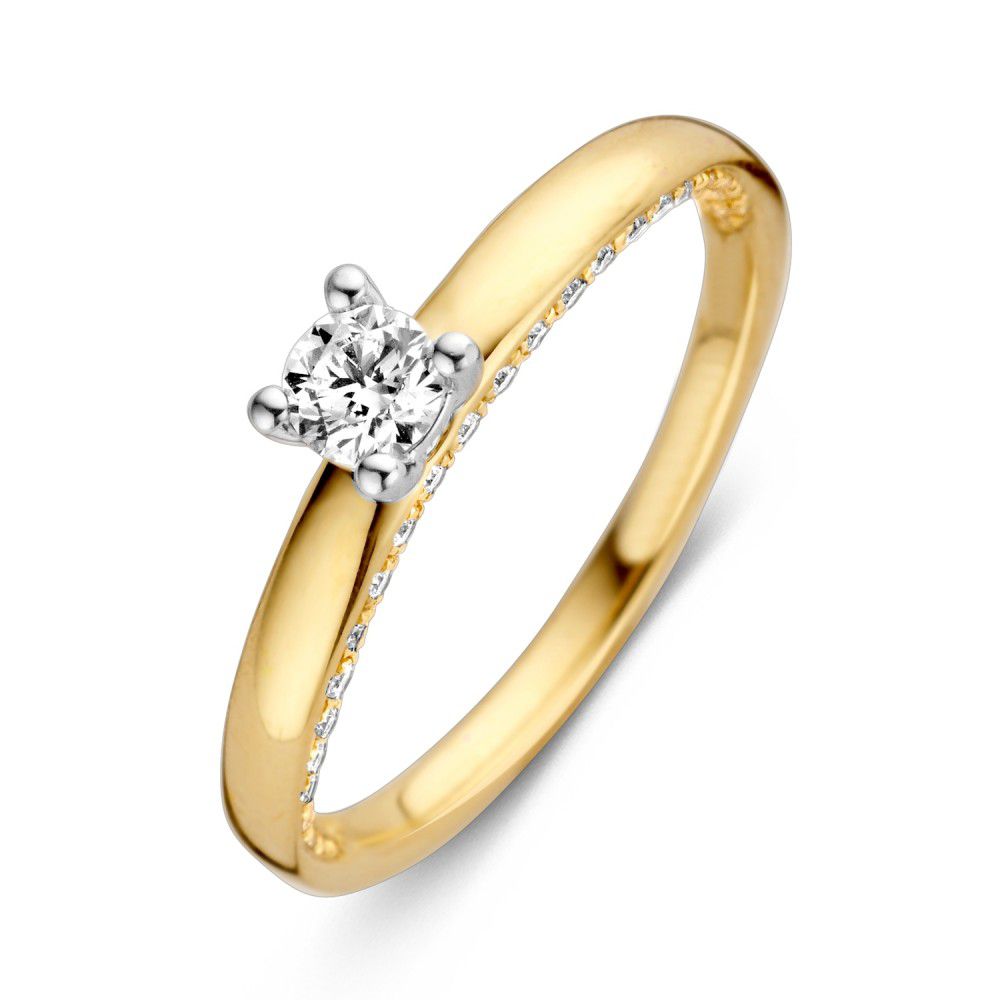Anello bicolore con brillante da 0,44 carati, finitura lucida e dettagli in oro giallo e bianco.