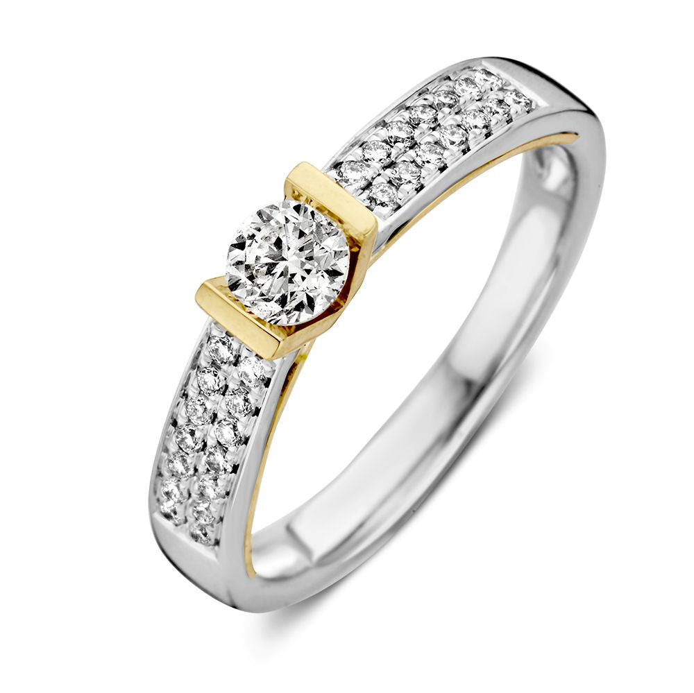 Anello bicolore in oro bianco e giallo con diamante brillante da 0,30 crt.