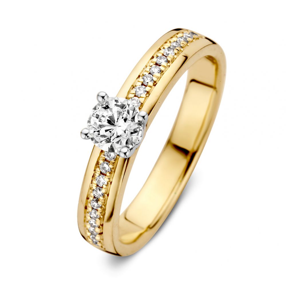 Anello da donna in oro giallo con diamante brillante di 0,40 ct e pavé di diamanti.