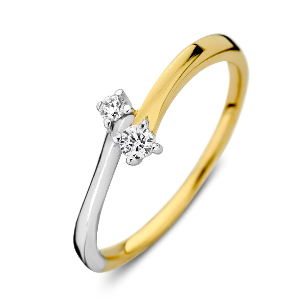 Anello in oro bicolore con zircone, una parte gialla e una parte bianca, design elegante.