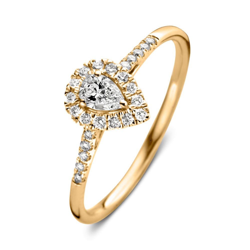 Anello in oro giallo con diamante centrale a forma di pera e zirconi.