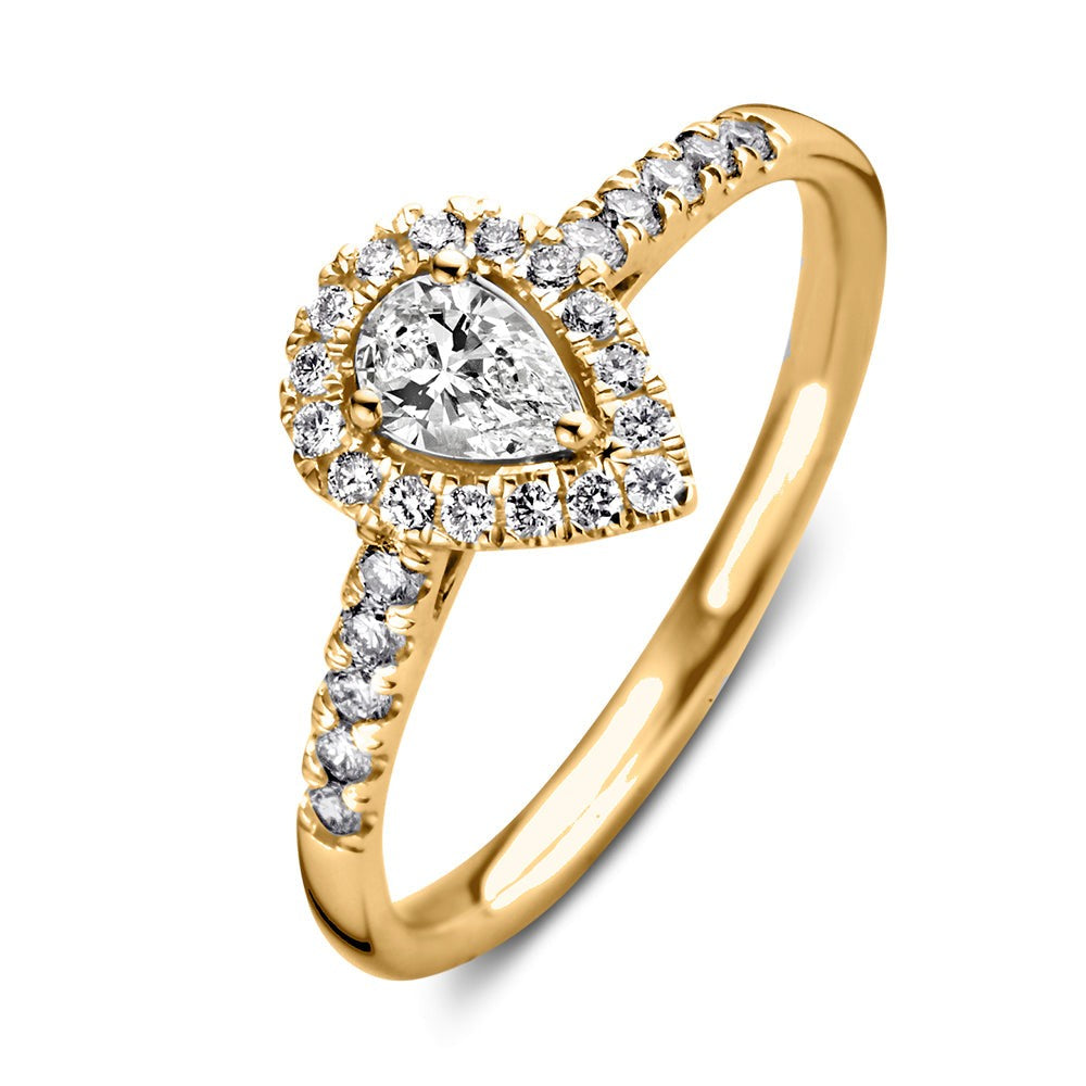 Anello in oro giallo con diamante a forma di pera e zirconi.