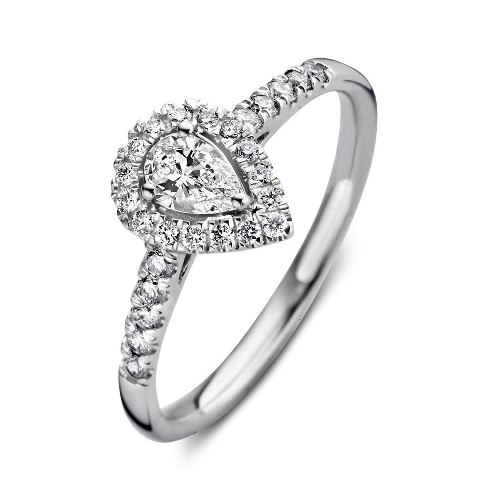 Anello in oro bianco con diamanti a forma di pera, decorato con pietre brillanti.