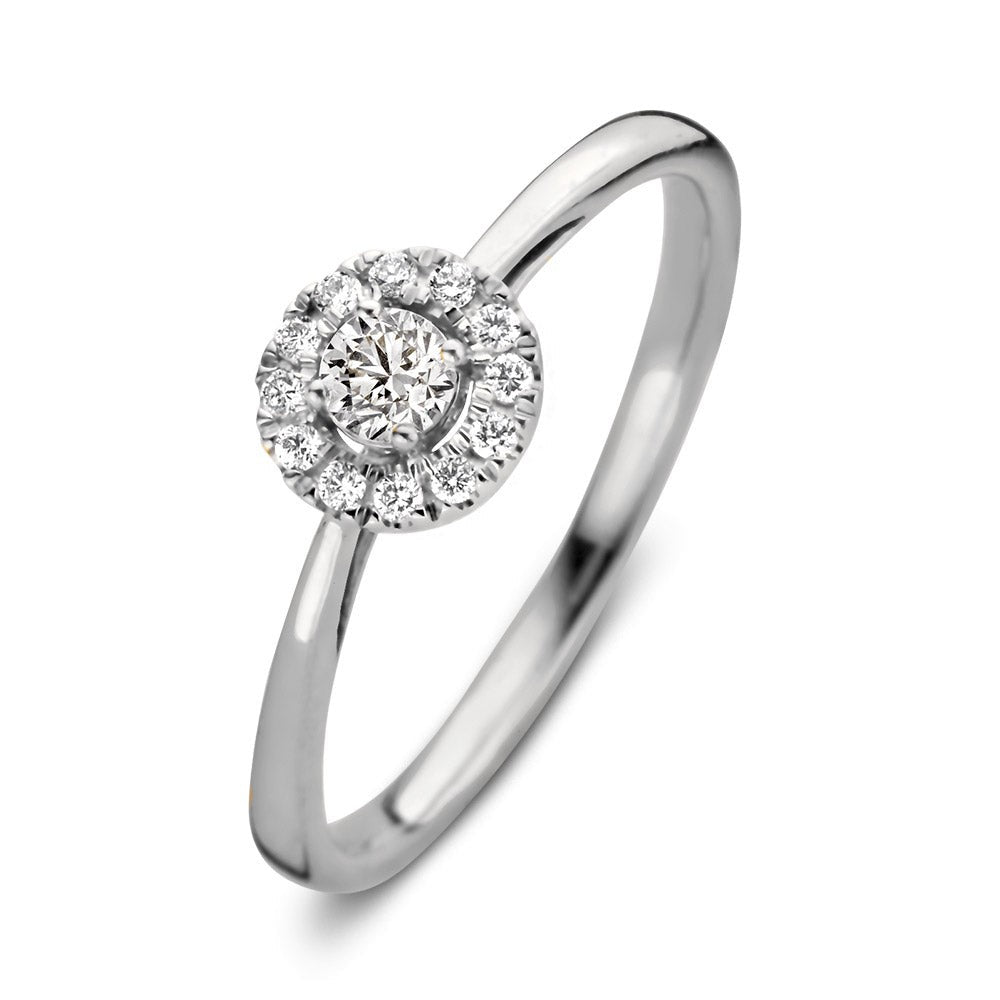 Anello in oro bianco con diamante centrale e contorno di diamanti.