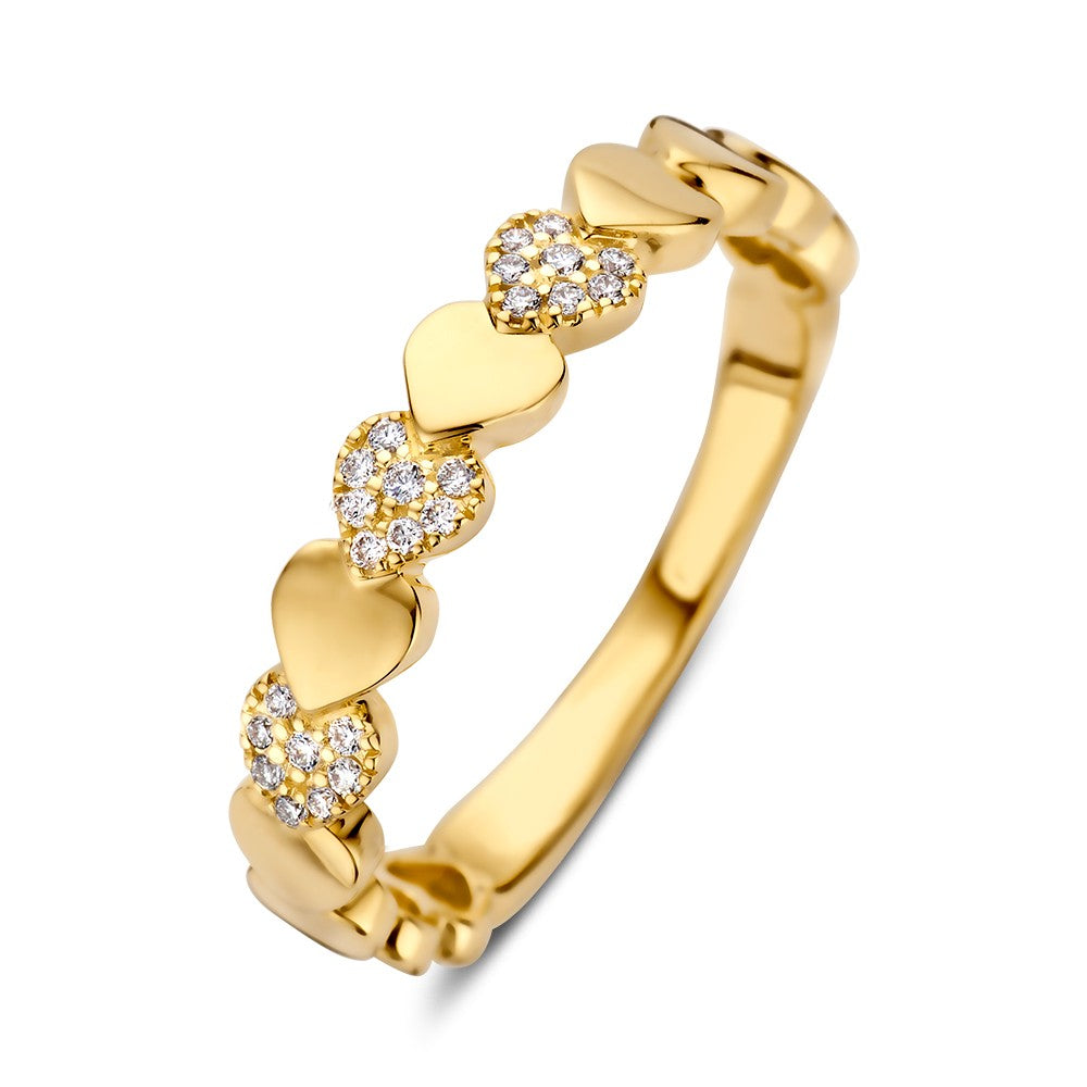 Anello in oro giallo con diamanti, decorato con cuori e dettagli lucidi.