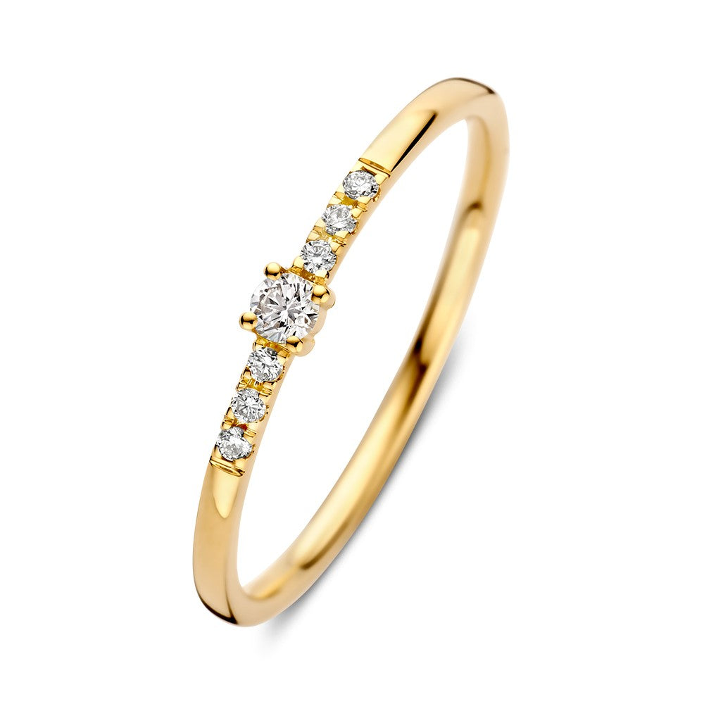 Anello in oro giallo con brillanti, centrale da 0,09 ct e sette brillanti laterali.