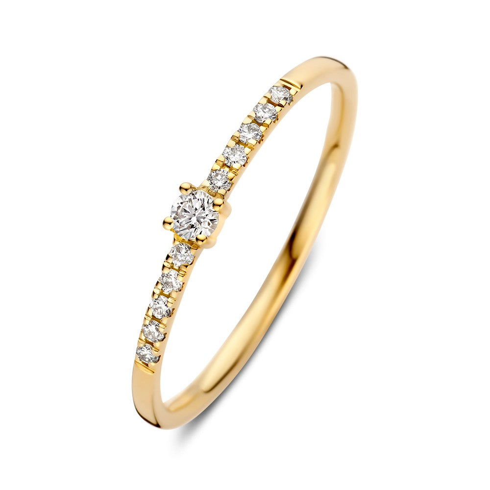 Anello in oro giallo con brillante centrale da 0,12 crt e pietre laterali.