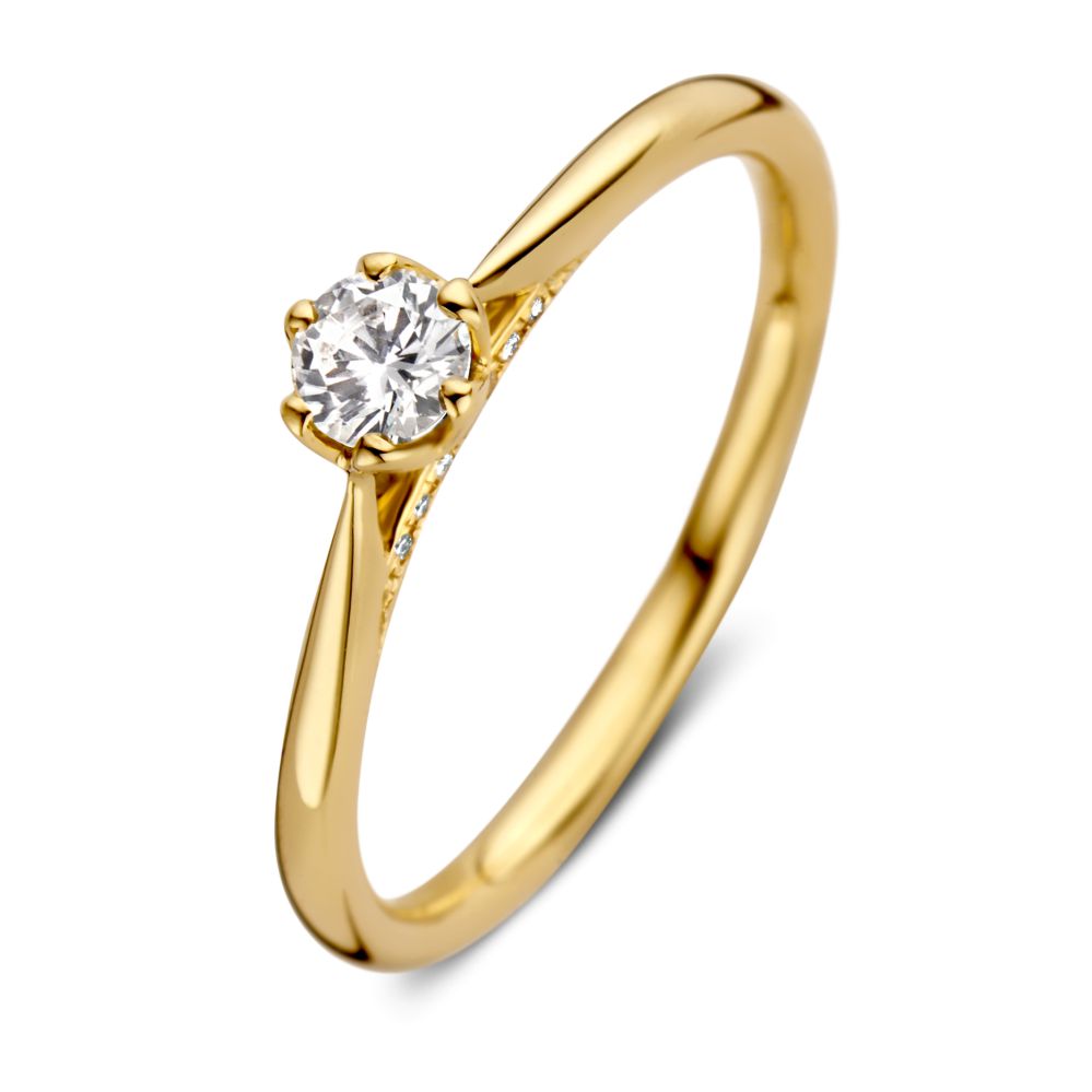 Anello solitario in oro giallo con brillante centrale e piccole diamanti da 0,26 ct.