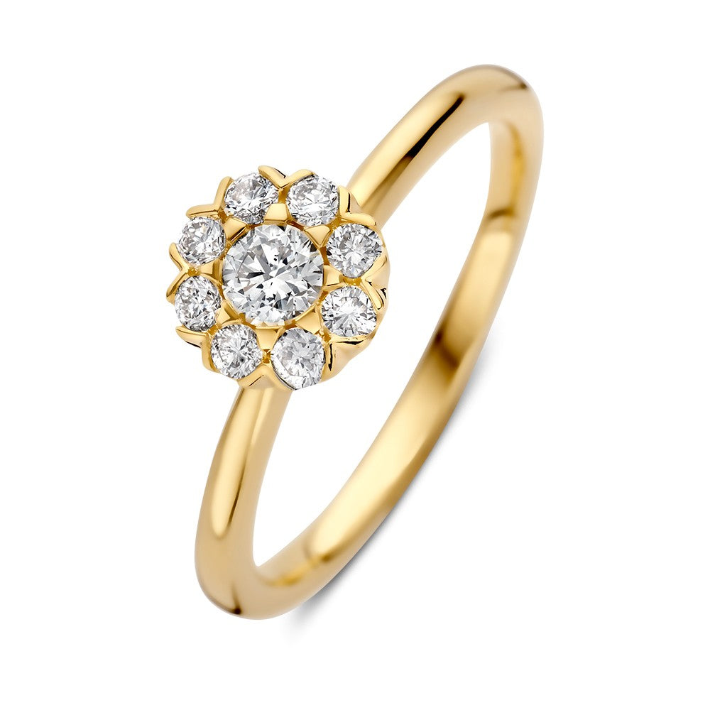 Anello in oro giallo con diamante centrale e diamanti circondanti.