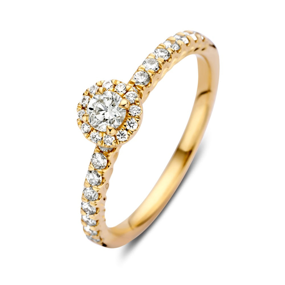 Anello in oro giallo con diamante centrale in brillantezza e incastonatura a entourage, 14 carati.